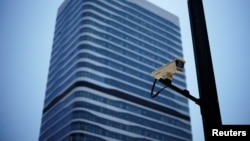 A surveillance camera is seen in front of an office building, where the office of Capvision is located, in Shanghai, China, May 9, 2023.