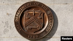 (FILE) A bronze seal for the Department of the Treasury is shown at the U.S. Treasury building in Washington, U.S., January 20, 2023. 