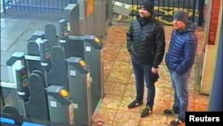 Alexander Petrov and Ruslan Boshirov, who were formally accused of attempting to murder former Russian intelligence officer Sergei Skripal and his daughter Yulia in Salisbury, are seen on CCTV at Salisbury Station, March 3, 2018, in an image handed out by the Metropolitan Police in London, Sept. 5, 2018.