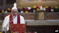 FILE - Pope Francis speaks in the Basilica of St. Bartholomew in Rome, April 22, 2017. 