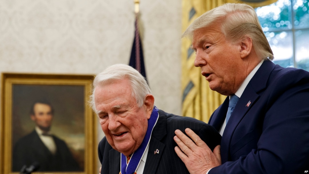 President Donald Trump presents the Presidential Medal of Freedom to former Attorney General Edwin Meese, in the Oval Office of the White House, Oct. 8, 2019.