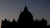 FILE - Saint Peter's Basilica is silhouetted against the sky at the Vatican, Dec. 16, 2023.