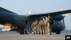 German weapons instructors, heading for Kurdistan board a Transall transport aircraft at the NATO airfield in Hohn, Germany, Sept. 19, 2014. 