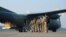 German weapons instructors, heading for Kurdistan board a Transall transport aircraft at the NATO airfield in Hohn, Germany, Sept. 19, 2014. 