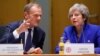 British Prime Minister Theresa May and European Council President Donald Tusk attend a round table meeting at an EU summit in Brussels, Nov. 25, 2018. 
