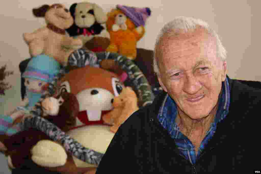 Jack Kieser is a cancer patient at West Gauteng Hospice. He sits in a room surrounded by toys left by the families of children who died at the hospice. (VOA / D. Taylor)