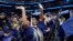 A graduate waves as students arrive Howard University's commencement in Washington, Saturday, May 13, 2023. (AP Photo/Alex Brandon)