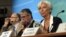 IMF Managing Director Christine Lagarde (R) speaks at a conference after the release of IMF's annual report on the U.S. economy in Washington, July 3, 2012. 