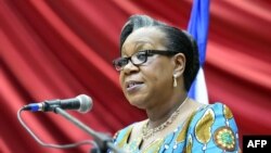 FILE - Transitional president of the Central African Republic, Catherine Samba Panza, gives a speech in Bangui before members of the Conseil National de Transition, the transitional parliament, May 6, 2014. Samba Panza pleads with the international community to help develop the war-ravaged country. 