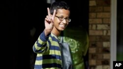 Ahmed Mohamed, 14, gestures as he arrives to his family's home in Irving, Texas, Sept. 17, 2015. 