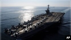 Nimitz-class aircraft carrier USS John C. Stennis transits the Strait of Hormuz, Nov. 12, 2011 (file photo).