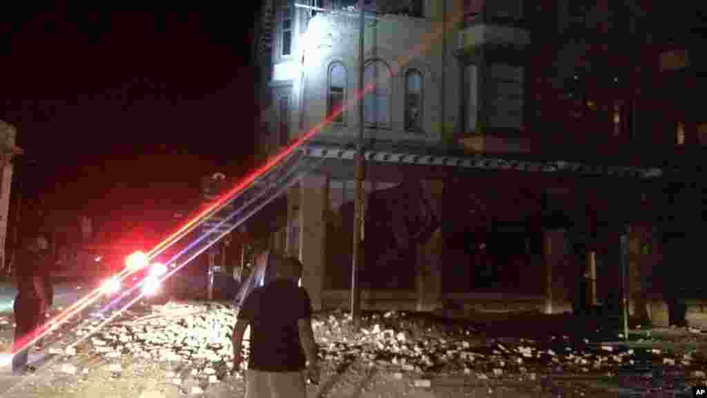 This photo provided by Lyall Davenport shows damage to a building in Napa, Calif. early Sunday, Aug. 24, 2014. 