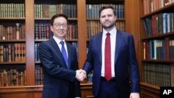 In this photo released by Xinhua News Agency, Chinese Vice President Han Zheng, as Chinese President Xi Jinping's special representative, left, meets with U.S. Vice President-elect JD Vance in Washington, Jan. 19, 2025. (Xinhua/Liu Weibing)