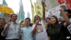 Pro-democracy Hong Kong lawmakers of the legislature council, Edward Yiu, Nathan Law, Leung Kwok-hung and Lau Siu-lai protest outside the High Court in Hong Kong, July 14, 2017.