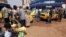 Central African Republic soldiers walk near a taxi station in Bangui, December 31, 2012.
