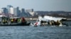 In this image provided by the US Coast Guard, wreckage is seen in the Potomac River near Ronald Reagan Washington National Airport, Jan. 30, 2025, in Washington. 