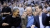 President Barack Obama talks with Vice President Joe Biden, center, and his son Hunter Biden, right, at the Duke Georgetown NCAA college basketball game, Jan. 30, 2010, in Washington. 