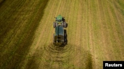 A custom hauler spreads dairy manure on hay ground in Wallenstein, Ontario, U.S., in the spring of 2018. (Husky Farm Equipment Ltd./Handout via REUTERS)
