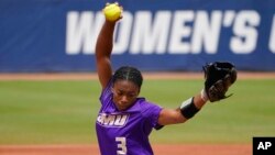 FILE - James Madison's Odicci Alexander pitches during an NCAA Women's College World Series softball game against Oklahoma, June 7, 2021, in Oklahoma City. 