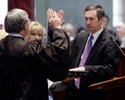 FILE - Tre Hargett, right, is sworn in as Tennessee secretary of state in Nashville, Tenn., Jan. 15, 2009.
