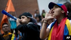 Demonstrators shout slogans against Venezuela's President Nicolas Maduro in Los Teques on the outskirts of Caracas, Venezuela, Sept. 7, 2016. 