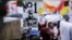Demonstrators carry placards as they march to protest against corruption in Cape Town, South Africa, Sept. 30, 2015. 