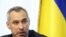 FILE - Ukraine's Prosecutor General Ruslan Ryaboshapka speaks during a news conference in Kyiv, Ukraine, Oct. 4, 2019. 
