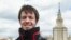 FILE - Nikolai Podchasov, a student at the Lomonosov Moscow State University, poses for a photo in front of the university during his interview with Associated Press in Moscow, Russia, April 23, 2015.