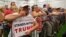 Campaign supporters listen to Republican U.S. presidential candidate Donald Trump address during a campaign stop at the Grand Park Events Center in Westfield, Indiana, July 12, 2016.