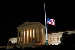 The American flag flies at half staff following the death of U.S. Supreme Court Justice Ruth Bader Ginsburg, outside of the U.S. Supreme Court, in Washington, U.S., September 18, 2020.