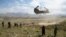 (FILES) In this file photo taken on June 6, 2019 a US military Chinook helicopter lands on a field outside the governor's palace during a visit by the commander of US and NATO forces in Afghanistan, General Scott Miller, and Asadullah Khalid, acting…