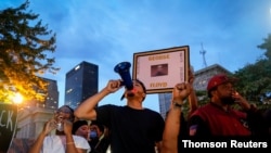 FILE - Protesters rally in Jefferson Square Park in Louisville, Kentucky, on June 2, 2020, following the death of Breonna Taylor. Officials are investigating a shooting at a similar rally at the park June 27, 2020.