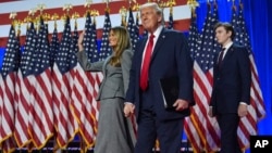 FILE - Republican presidential nominee former President Donald Trump, Melania Trump and Barron Trump, arrive to speaks at an election night watch party, Nov. 6, 2024, in West Palm Beach, Fla.