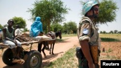 FILE - A UNAMID peacekeeper is seen on patrol in Sudan.