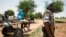 FILE - A UNAMID peacekeeper is seen on patrol in Sudan.