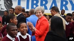 British Prime Minister Theresa May meets pupils during a visit at the the ID Mkhize High School in Gugulethu, Cape Town, South Africa, Aug. 28, 2018. 