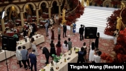 Actors practice, or rehearse, with the crew on the set of a micro drama recorded at a dining hall in Zhengzhou, Henan province, China, July 16, 2024. (REUTERS/Tingshu Wang)