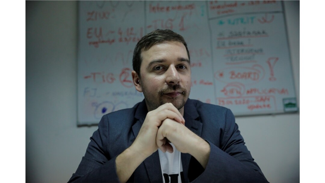 FILE - Stevan Dojcinovic, an editor of Serbia's investigative web portal Krik, known for its reports on corruption and organized crime, poses for a picture in Belgrade, Serbia, Dec. 18, 2019.