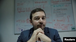 Stevan Dojcinovic, an editor of Serbia's investigative web portal Krik, known for its reports on corruption and organized crime, poses for a picture in Belgrade, Serbia, Dec. 18, 2019.