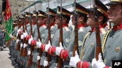 Afghan guards of honor stand in line after raising Afghanistan's flag during the transfer of authority in Bazarak, Panjshir province north of Kabul, Afghanistan, July 24, 2011