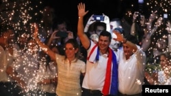 Paraguayan presidential candidate Santiago Pena from the ruling Colorado Party celebrates at the party headquarters as he and his running mate Pedro Alliana won Paraguay's presidential race in Asuncion, Paraguay April 30, 2023. 