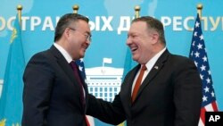 U.S. Secretary of State Mike Pompeo, right, reacts after holding a joint news conference with Kazakh Foreign Minister Mukhtar Tleuberdi at the Ministry of Foreign Affairs in Nur-Sultan, Kazakhstan, Feb. 2, 2020.