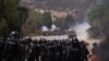 Bolivian security forces confront supporters of former President Evo Morales, who block key highways amid rising political tensions between a faction around Morales and the government of President Luis Arce, in Parotani, Bolivia, Nov. 1, 2024.