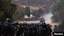 Bolivian security forces confront supporters of former President Evo Morales, who block key highways amid rising political tensions between a faction around Morales and the government of President Luis Arce, in Parotani, Bolivia, Nov. 1, 2024.