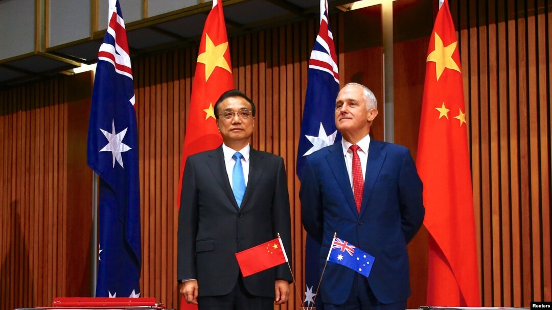 FILE - Australia's Prime Minister Malcolm Turnbull stands with Chinese Premier Li Keqiang before the start of an official signing ceremony at Parliament House in Canberra, Australia, March 24, 2017. 