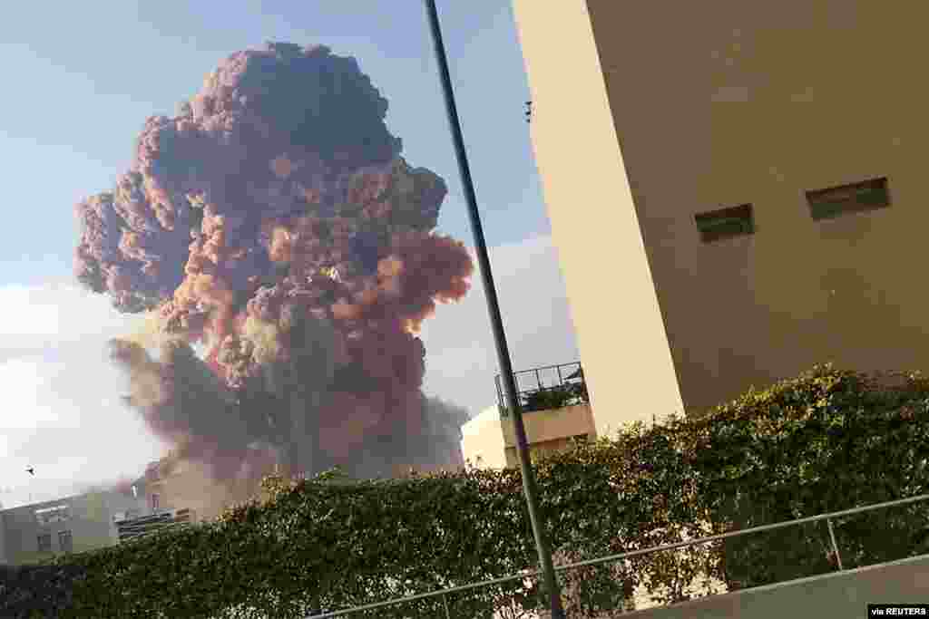 Smoke rises after an explosion in Beirut, Lebanon, Aug. 4, 2020, in this picture obtained from a video by Instagram user Karim Sokhn.