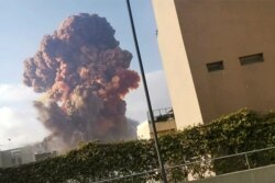 Smoke rises after an explosion in Beirut, Lebanon, Aug. 4, 2020, in this picture obtained from a video by Instagram user Karim Sokhn.