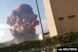 Smoke rises after an explosion in Beirut, Lebanon, Aug. 4, 2020, in this picture obtained from a video by Instagram user Karim Sokhn.