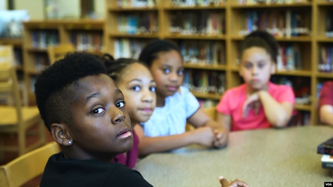 Students at George P. Phenix School in Hampton, Virginia, discuss slavery and race relations with the school principal.