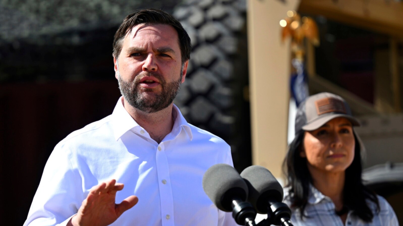 Vice President JD Vance speaks to reporters during a visit to the US border with Mexico, March 5, 2025, in Eagle Pass, Texas, as Director of National Intelligence Tulsi Gabbard listens.
